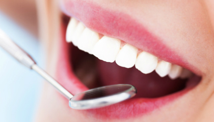 Dental mirror held against the upper front teeth